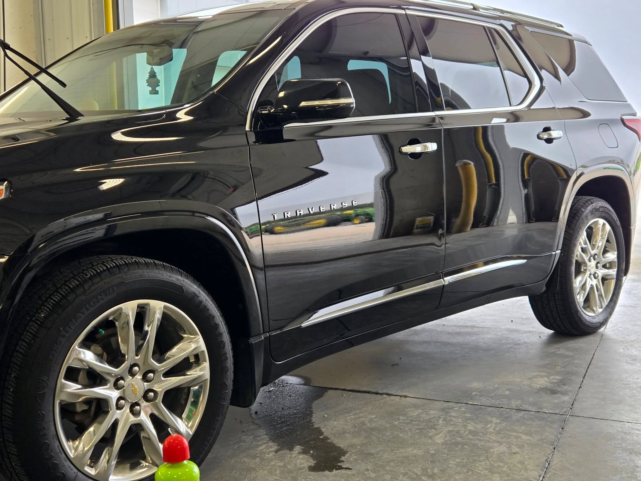 Black GMC Acadia detailed with a deep, glossy shine