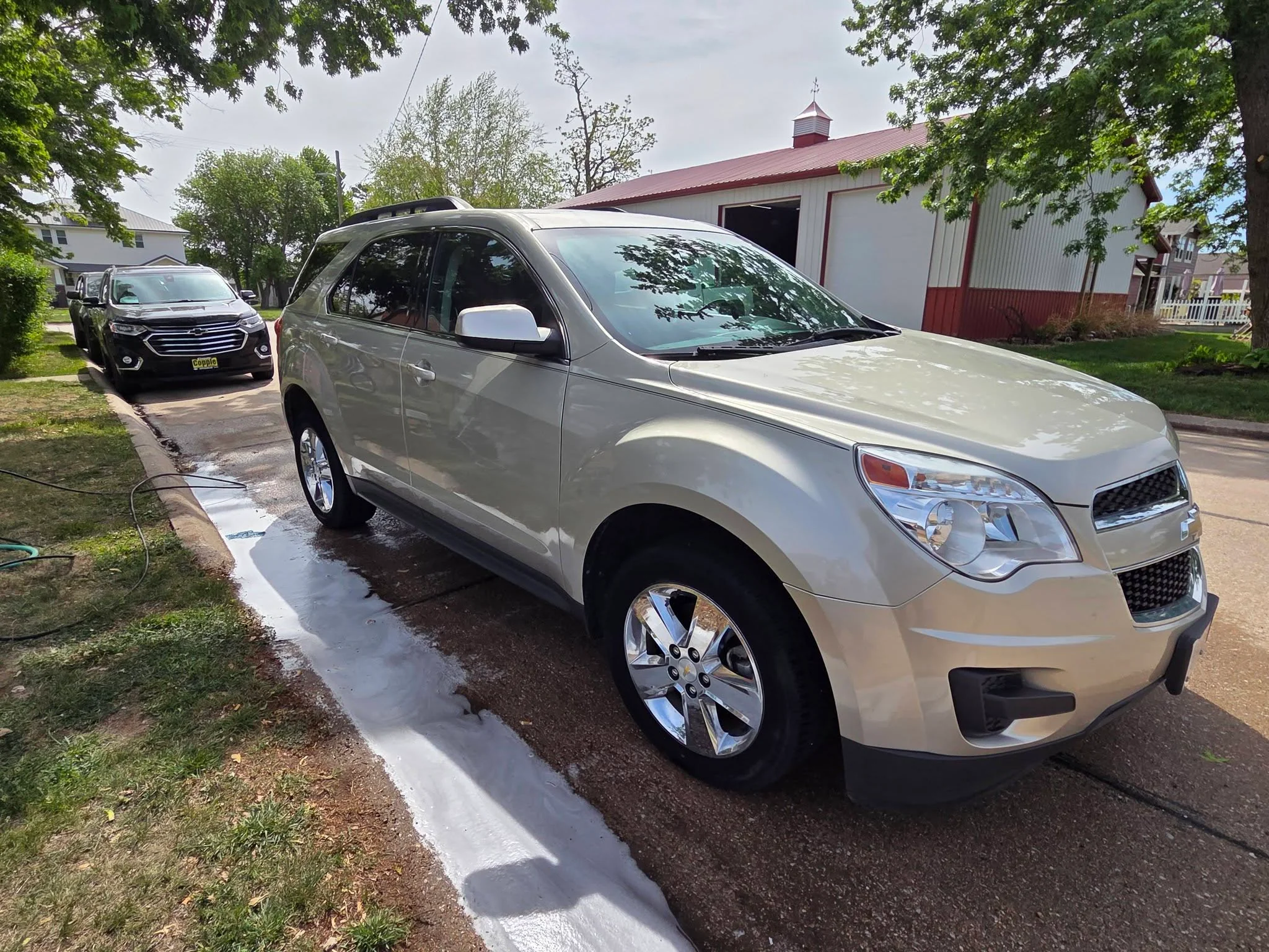 Champagne Chevy Equinox detailed in a Deshler driveway