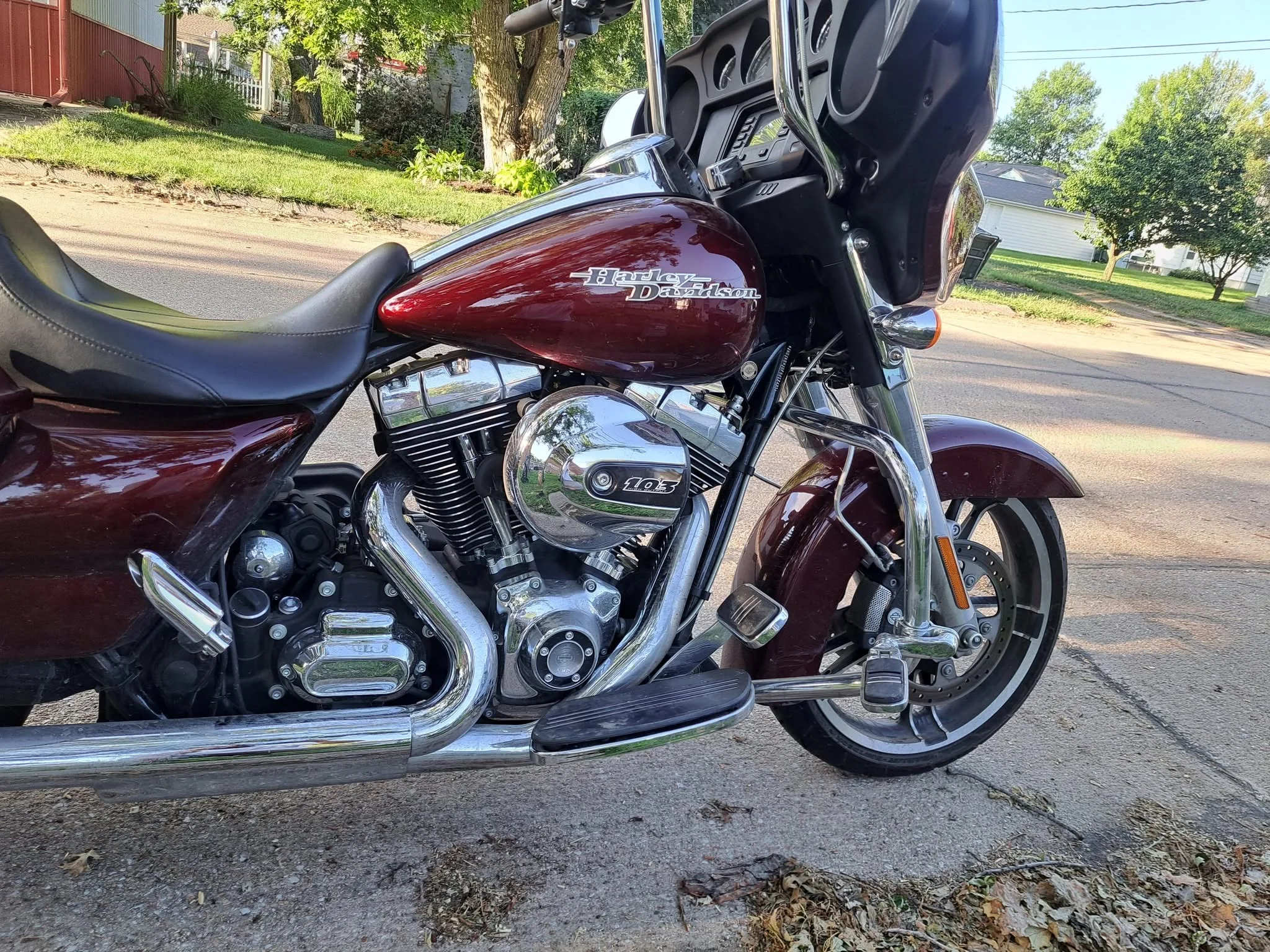 Maroon Harley-Davidson touring motorcycle detailed with polished chrome