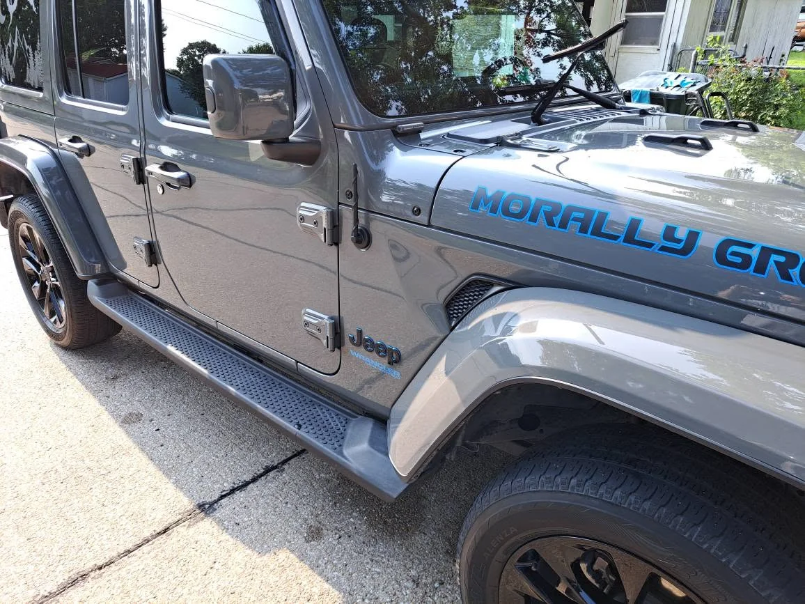 Grey Jeep Wrangler detailed, running boards and paint shining