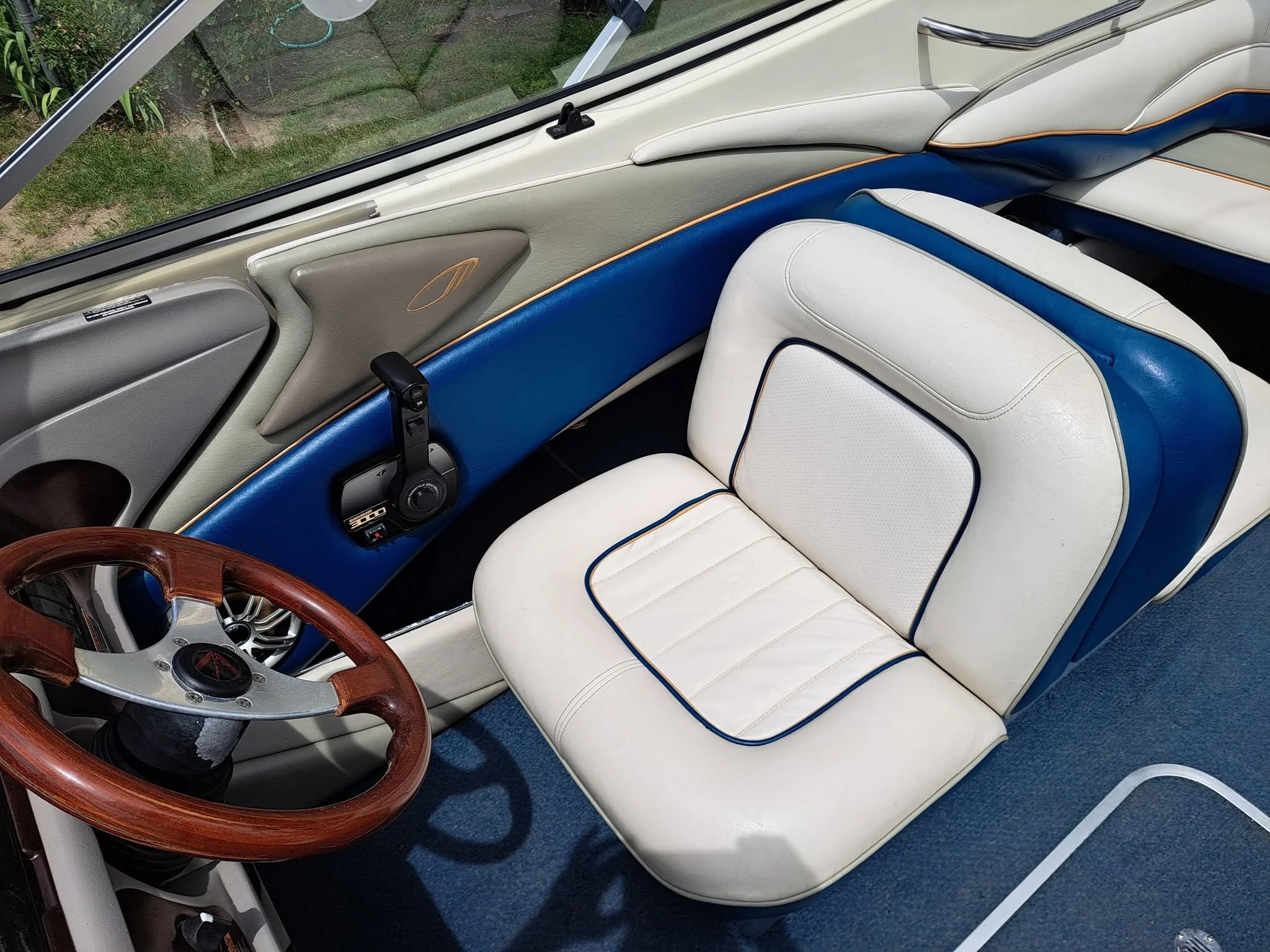 Boat interior detailed, white and blue leather seats cleaned