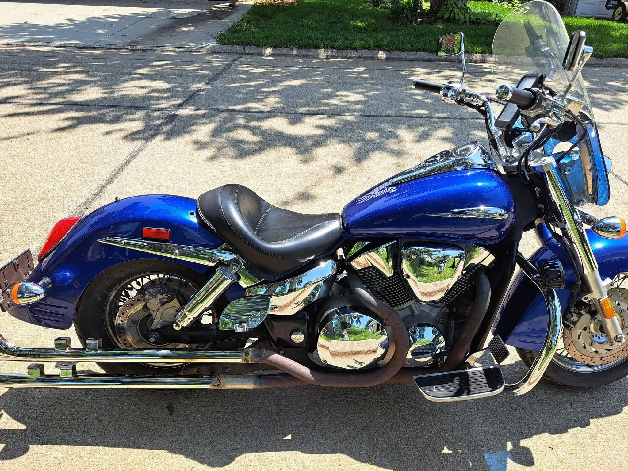 Blue cruiser motorcycle detailed with polished chrome engine
