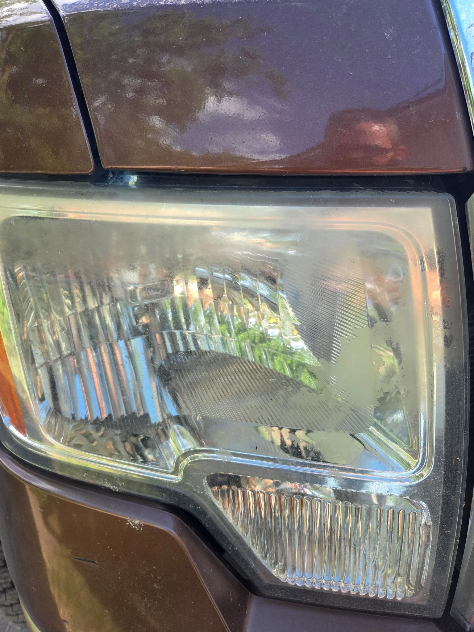Brown Ford F-150 with a freshly restored headlight