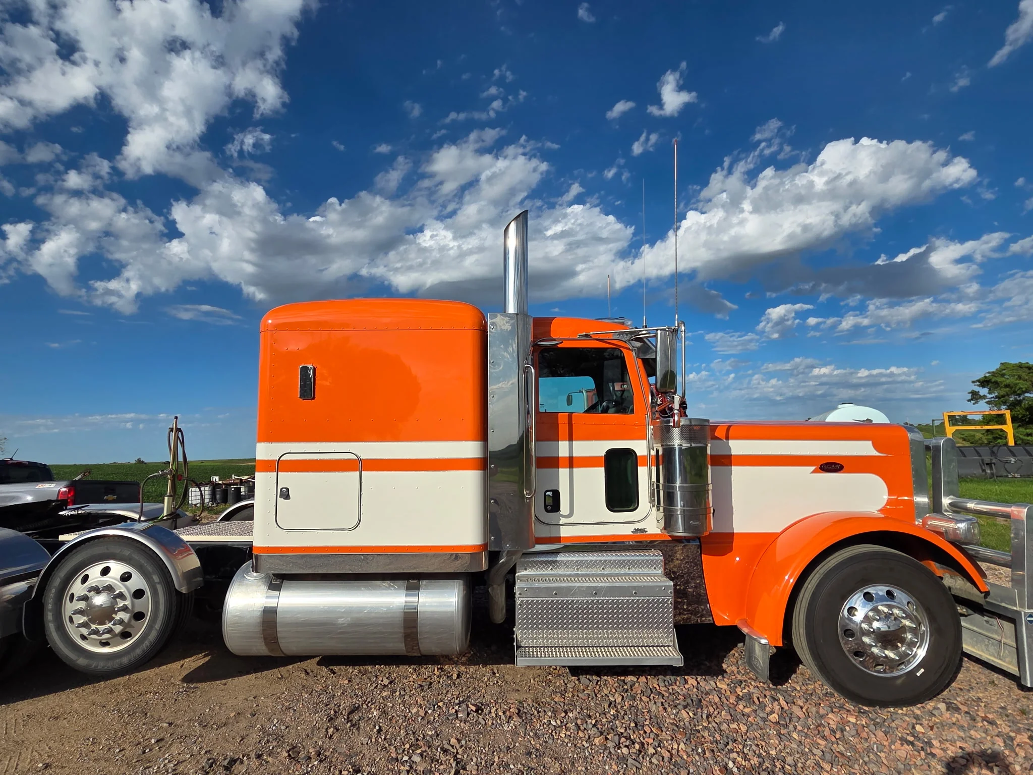 Orange and cream Peterbilt semi detailed with polished chrome wheels
